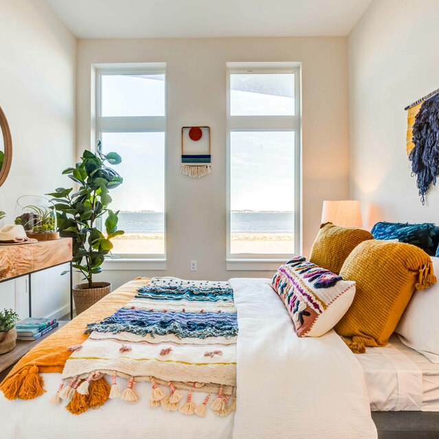 Ryder Revere Beach - Bedroom With Decorative Pillows and Wall Art